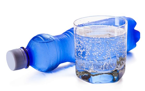bottle and glass of water isolated on a white background