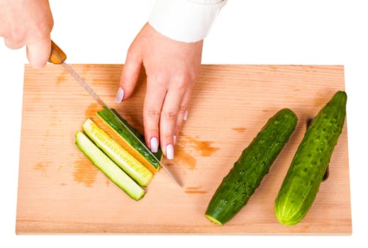 cook sliced fresh cucumber on a wooden board