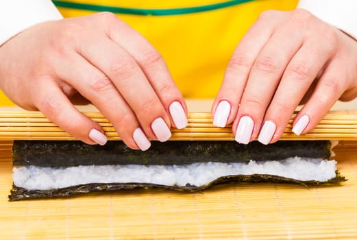 cook hands twisted rolls on a wooden board