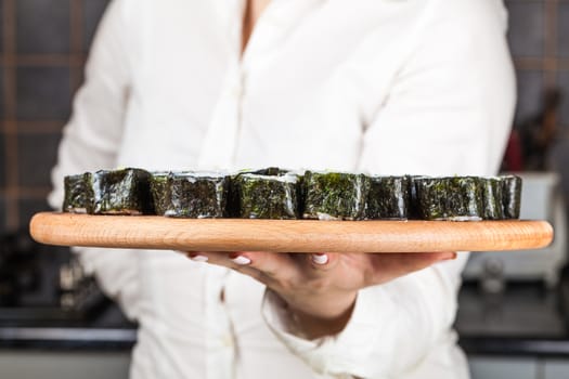 fresh sushi roll closeup on a wooden board