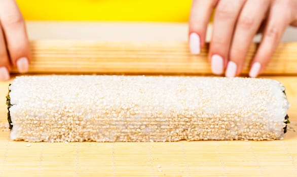 fresh sushi roll closeup on a wooden board