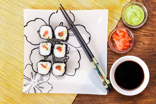 fresh sushi roll closeup on a wooden board