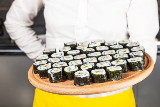 fresh sushi roll closeup on a wooden board