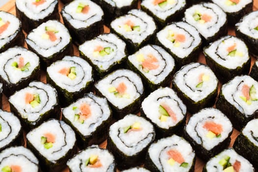 fresh sushi roll closeup on a wooden board