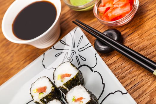 fresh sushi roll closeup on a wooden board