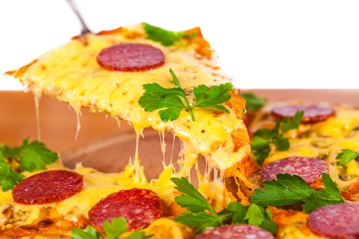 slice of pizza with cheese and salami closeup