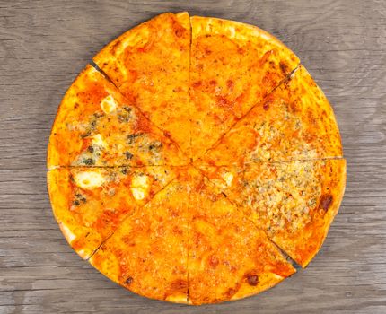 hot pizza four cheese on a wooden background