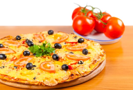 hot fresh a pizza with tomatoes on a wooden background