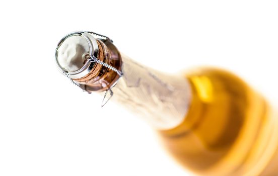 a bottle of sparkling champagne isolated on white background