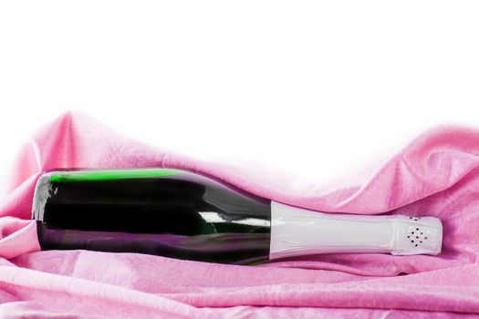  bottle of champagne wrapped in pink tissue