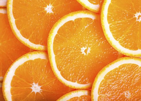 background of fresh juicy orange lobules closeup