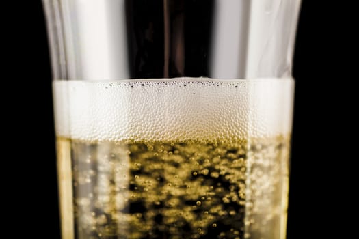 champagne in glass closeup on a dark background
