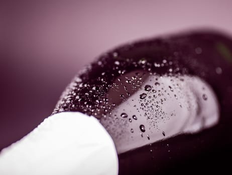 bottle of champagne close-up on a dark background