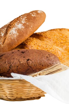 bread in a basket different sorts isolated on white background