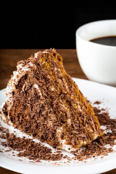 chocolate cake on a plate on a dark background