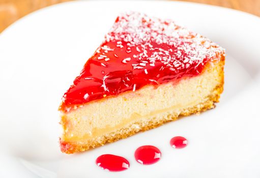 a piece of fruit cheesecake on a white plate