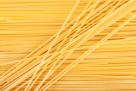 background raw pasta lined with diagonally and horizontally