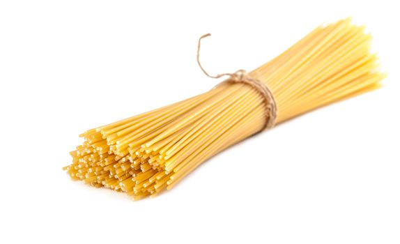 sheaf raw spaghetti on a white background isolated