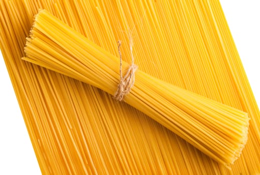 yellow background neatly laid out raw pasta