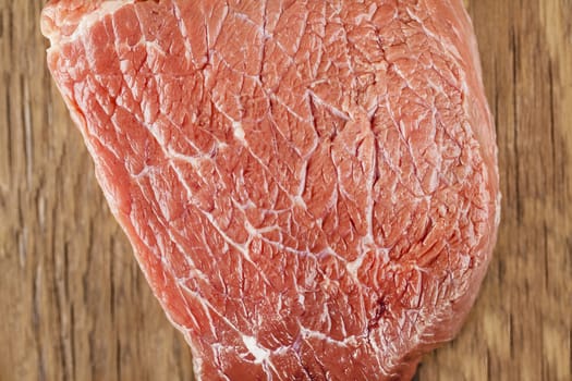 raw beef filet closeup on wooden background