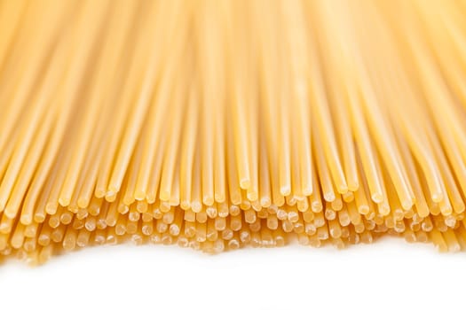 background neatly lined with vertically raw pasta 