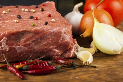 beef fillet with herbs closeup on wooden background