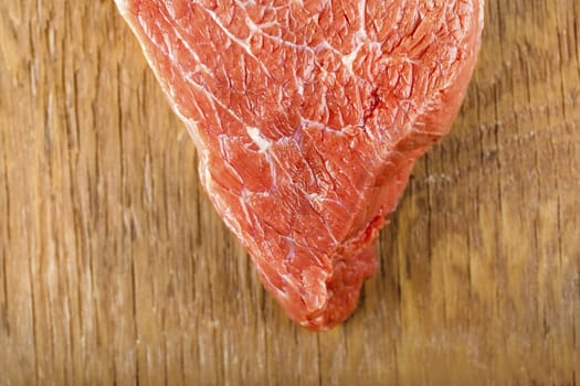 fresh beef filet closeup on wooden background
