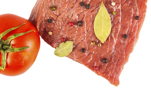 beef filet with spices and tomato, white background