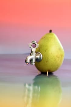 pear with a tap on the colorful background