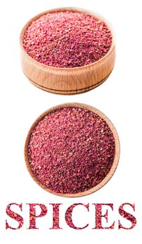 sumac in a wooden bowl isolated on white background