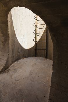 concrete structure monument with a hole and ladder