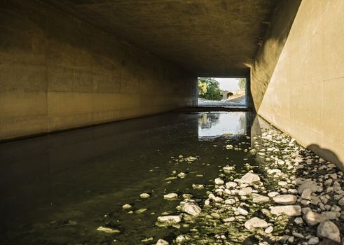 architectural building with high stone walls river flows