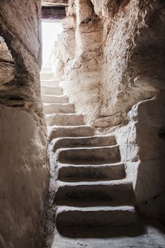 stone staircase leads up from an ancient property