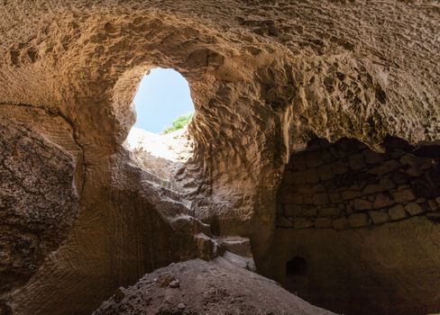 entrance into the cave, summer day