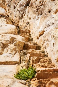 stone staircase leads up to the rock