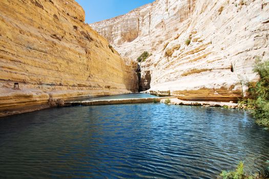 lake in a rocky gorge sunny summer day
