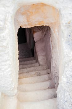 descent into the chalk cave entrance with a stone staircase