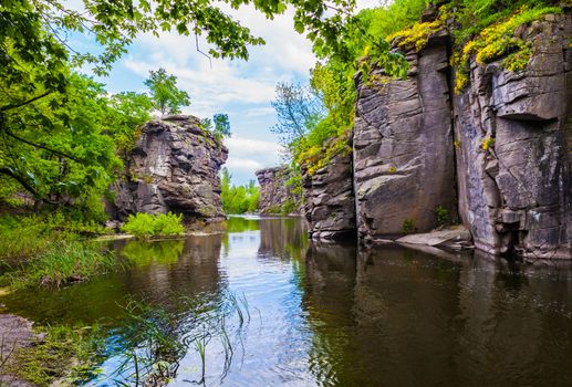 scenery rocky canyon with river and forest