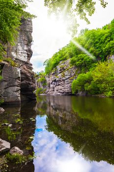 scenery rocky canyon with river and forest