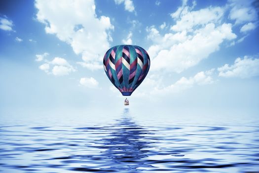 balloon flying low over the water