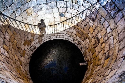 vintage, antique, a stone well with sky reflection
