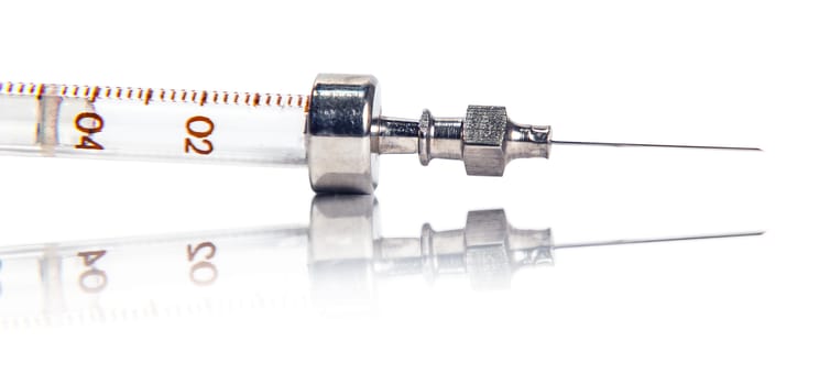 Syringe with reflection on white background