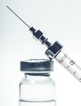 injection syringe closeup, medicine background