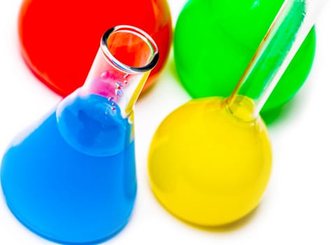 jar with colored reagents closeup  on a white background