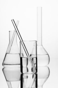 set of chemical glass bottle with reflection on white background