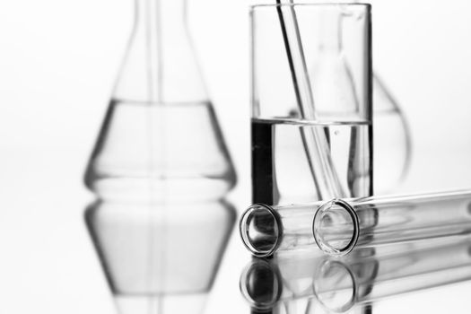 chemical glass bottle with reflection on white background