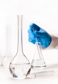 mix reagents into the flask on a white background