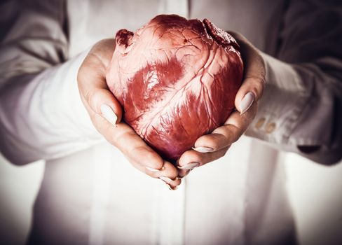 heart in hands, abstract creative background 