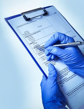 doctor fills patient's history, hospital  background
