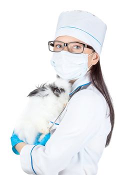 portrait of a doctor with a decorative rabbit in hands on a white background